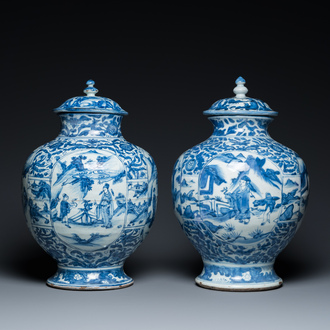 A pair of Chinese blue and white vases and covers with figurative design, Ming