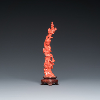 A Chinese red coral figure of a standing lady with a flower basket, 19/20th C.