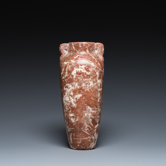 An Egyptian red Breccia jar, Predynastic period, 3500-2900 b.C.