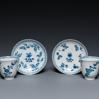 A pair of Chinese blue and white cups and saucers, Chenghua mark, Kangxi