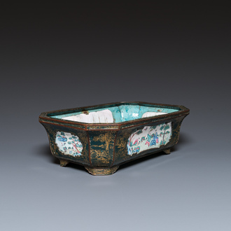 A Chinese Canton enamel gilt-decorated dark-green-ground jardinière with four inserted plaques, Qianlong/Jiaqing