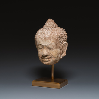 A large Thai stucco head of Buddha, Haripunchai region, 13th C.