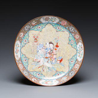 A Chinese Canton enamel dish with a lady and two boys, Yongzheng