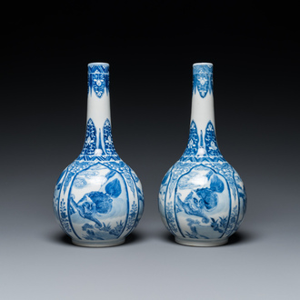 A pair of Chinese blue and white bottle vases with mythical animals, 19th C.