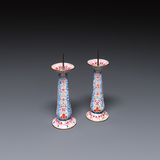 A pair of Chinese Canton enamel candlesticks, Yongzheng/Qianlong