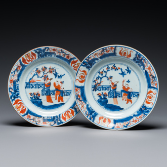 A pair of Chinese Imari-style 'lady with two boys' plates, Kangxi