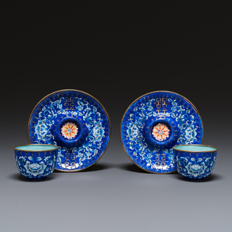 A pair of Chinese Canton enamel trembleuse cups on stands with double 'Shou' design, Qianlong