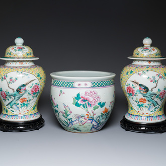 A pair of Chinese famille rose covered vases and a jardinière, 19/20th C.