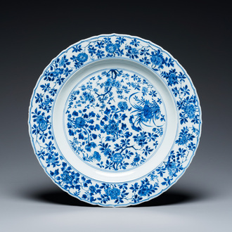 A Chinese blue and white 'four seasons' dish, Kangxi mark and of the period