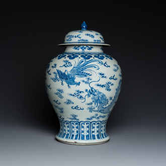 A Chinese blue and white 'dragons and phoenixes' vase and cover, Kangxi mark, 19th C.