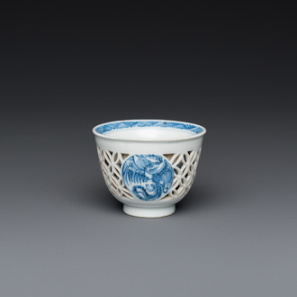 A rare Chinese reticulated double-walled blue and white 'phoenix' cup, Kangxi