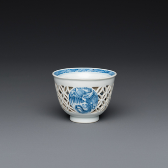A rare Chinese reticulated double-walled blue and white 'phoenix' cup, Kangxi