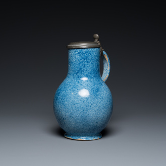 A monochrome blue Brussels faience jug with pewter cover, 18th C.