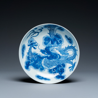 A Chinese blue and white plate with a dragon chasing the flaming pearl, Yongzheng mark and of the period