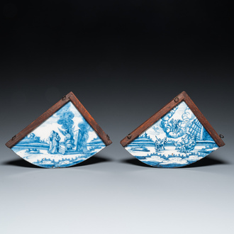 A pair of rare Dutch Delfware blue and white corner or quadrant tiles with biblical scenes, Amsterdam, 1st half 18th C.