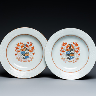 A pair of Chinese armorial plates with bianco-sopra-bianco rims, Qianlong