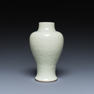 A Chinese celadon-glazed vase with underglaze floral design, Kangxi