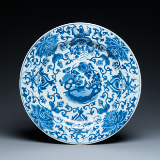 A Chinese Dutch market blue and white armorial dish with the arms of 'Pelgrom', Kangxi