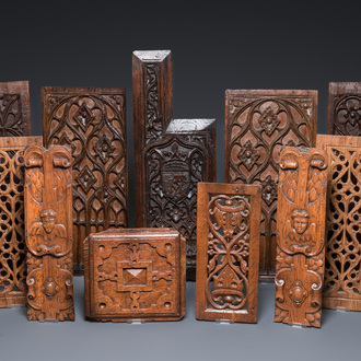 A collection of 11 carved wooden panels with various designs, France, Holland and/or Flanders, 14/16th C.