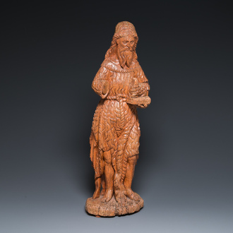 A large carved oak sculpture of John the Baptist holding the Lamb, 16th C.