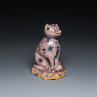 A manganese faience model of a cat, probably northern France, dated 1709