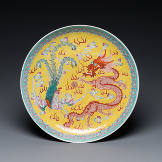 A Chinese yellow-ground famille rose 'dragon and phoenix' dish, Qianlong mark, 19/20th C.