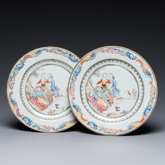 A pair of fine Chinese famille rose plates with a musician playing in front of a couple, Qianlong