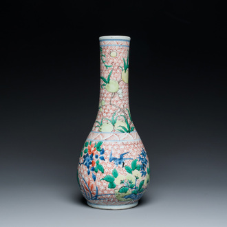 A Chinese wucai bottle vase with birds surrounded by fruits and foliage, Transitional period