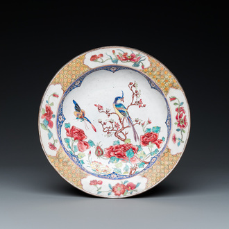 A Chinese 'ruby back' Canton enamel plate with a butterfly and a pheasant, Yongzheng