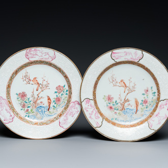 A pair of Chinese famille rose 'magpie and prunus' plates with bianco-sopra-bianco rims, Yongzheng