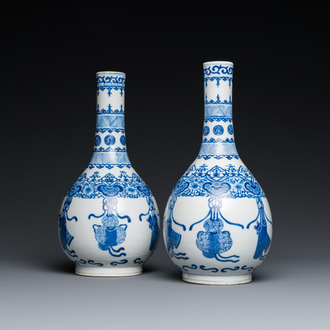 A pair of Chinese blue and white bottle vases, 19th C.