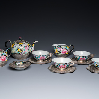 A Chinese eight-piece silver-mounted famille rose millefleurs tea service, Qianlong mark, 20th C.