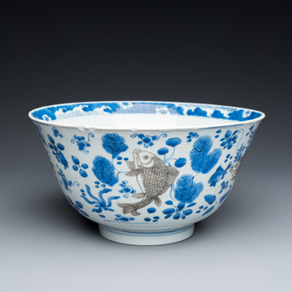 A Chinese blue, white and copper-red 'carps' bowl, Kangxi