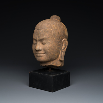 A Khmer stone head of Jayavarman VII in Bayon-style, Cambodia, probably 13th C.