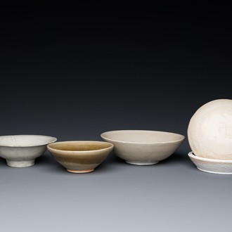 Three Chinese celadon- and qingbai-glazed bowls and a cream-glazed box and cover, Song and later