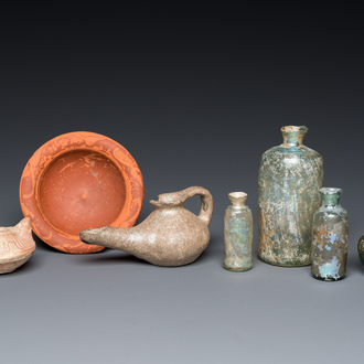 Four Roman glass bottles, two pottery oil lamps and a bowl