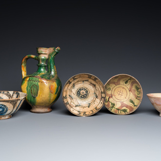 A Turkish Canakkale green- and yellow-glazed ewer and four Islamic pottery bowls, 15th C. and later