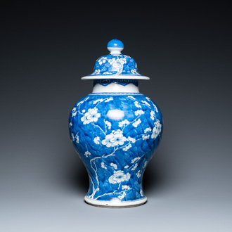 A Chinese blue and white 'prunus on cracked ice' vase and cover, Kangxi