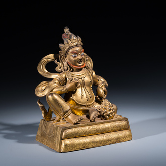 A fine Sino-Tibetan gilt bronze sculpture of Jambhala, 18th C.