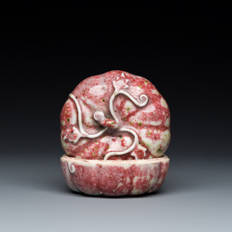 A Chinese peachbloom-glazed pumpkin-shaped box and cover, 19th C.