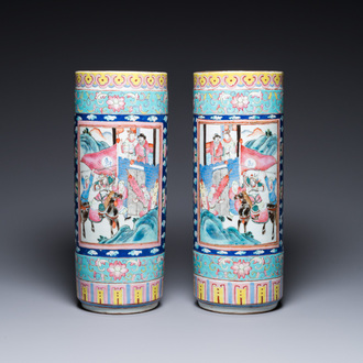 A pair of Chinese famille rose cylindrical vases, 19th C.