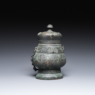 A Chinese archaic bronze ritual 'you' wine vessel and cover in Western Zhou-style, Ming