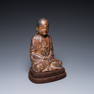 A Chinese gilt-lacquered wood sculpture of Buddha, Ming
