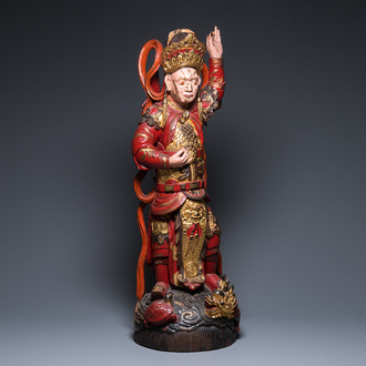 A large Vietnamese red-and-gilt-lacquered wood sculpture of a heavenly king, 19/20th C.