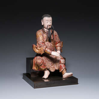 A large Chinese lacquered and polychromed wood sculpture of Guandi, 18th C.