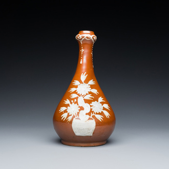 A Chinese slip-decorated brown-ground bottle vase, Zhushan kilns, late Ming