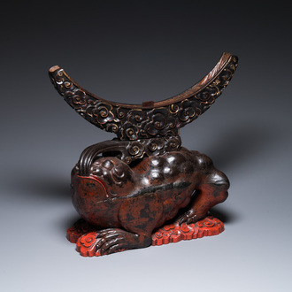 A large Chinese lacquered wooden stand in the shape of a three-legged toad, Ming