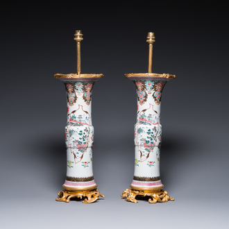 A pair of Chinese famille rose vases with fine gilt bronze lamp mounts, Yongzheng