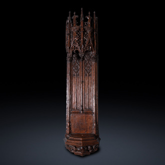 A fine carved oak niche with gothic architectural crowning, 15/16th C.