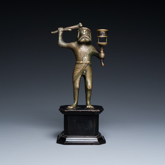 A rare bronze 'wild man' candlestick, Flanders or Germany, 15/16th C.